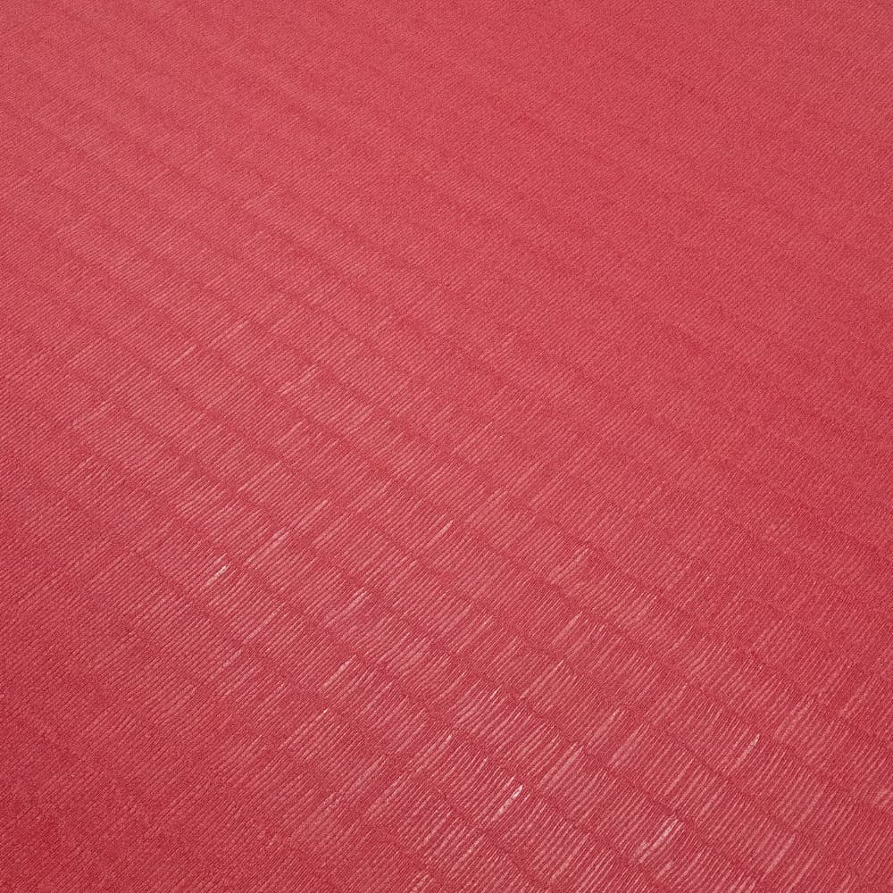Red tatami-finish martial arts mat showing diagonal waffle anti-slip texture across the surface.